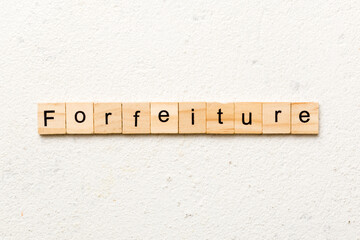 forfeiture word written on wood block. forfeiture text on table, concept - obrazy, fototapety, plakaty