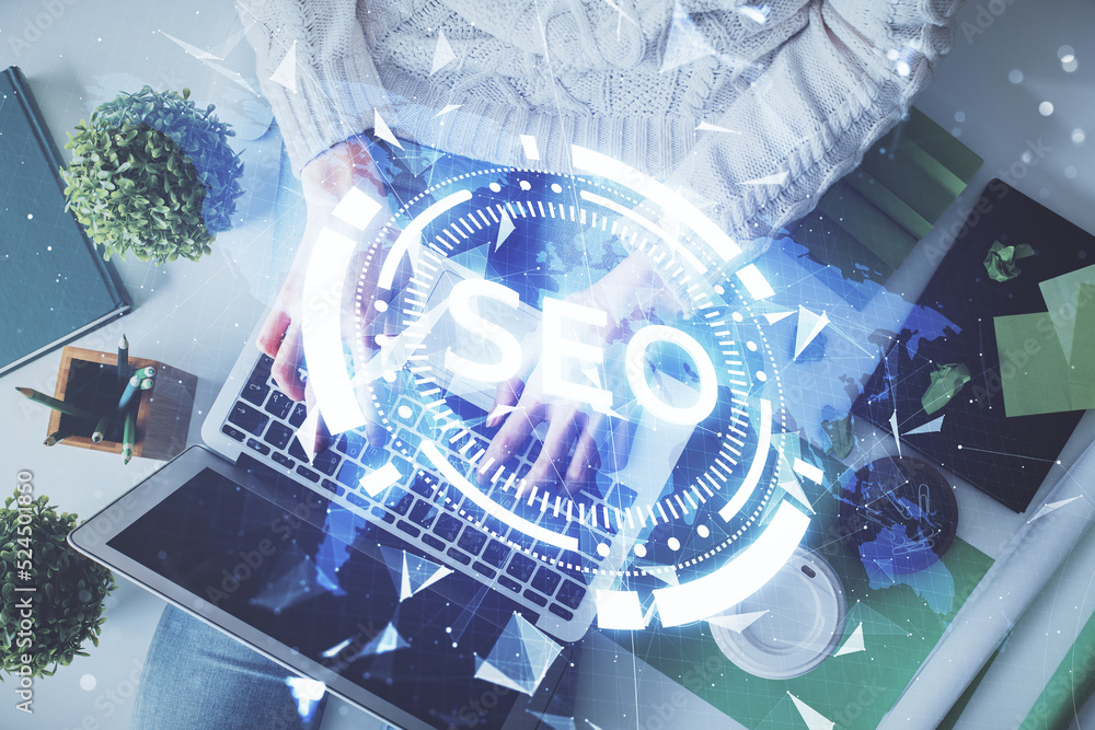 Poster double exposure of woman hands working on computer and seo hologram drawing. top view. search optimi