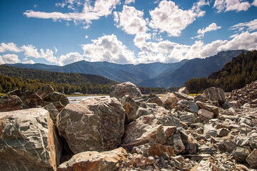Landscape with stones against the backdrop of mountains