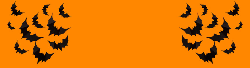 Banner of Halloween photo of black bats, ghost on blank orange background. Halloween decoration