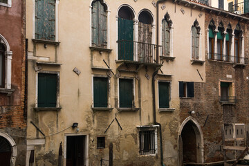Facade of ancient buildings at the historical city of Venice, Veneto, Italy.