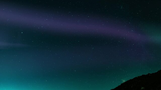 Aurora Borealis Purple and Green Loop Winter Mountain Hills Northern Lights