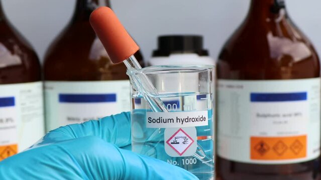Sodium hydroxide in glass, chemical in the laboratory and industry