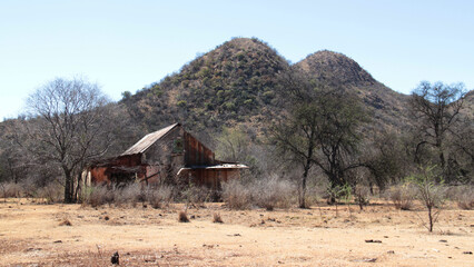 Photo of abandoned old houses and buildings in South Africa, red stone, mud and stone walls