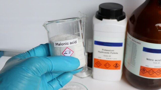 malonic acid in glass, chemical in the laboratory and industry