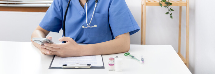 Veterinarian or animal nurse is using a phone or tablet to collect veterinary history and recommend a medical diagnosis in a hospital, Save animals, Care and treatment, Animal hospital.