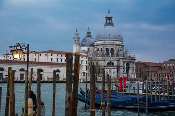 Naklejka premium Two domes and a tower and gondolas in the Grand Canal of Venice, Veneto, Italy.