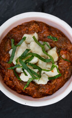Top view of traditional goulash stew, with veil and gnocchi. 