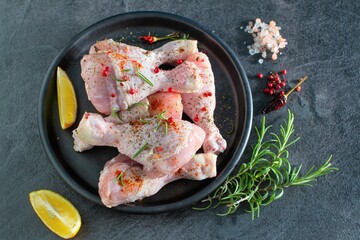 Raw marinated chicken legs meat, ready to cook 