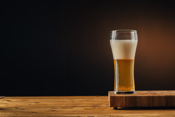 Glass beer on wood board with space for text