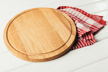 Wood round cutting board with napkin