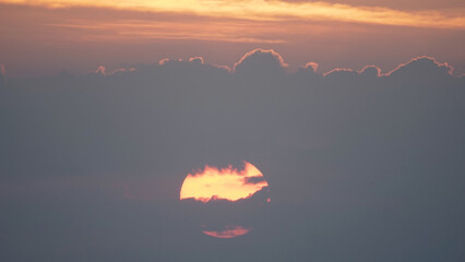 Big sun with clouds