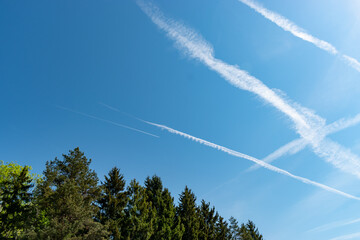 Contrails in the blue sky over Switzerland