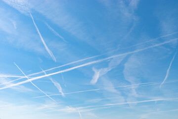 Contrails in the blue sky over Switzerland