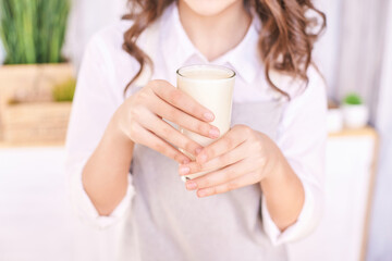 Young girl cooking at kitchen with vegetables. pretty child portrait. Chef student. Attractive brunette. Children emotion. People baking in cook apron. Close recipe menu