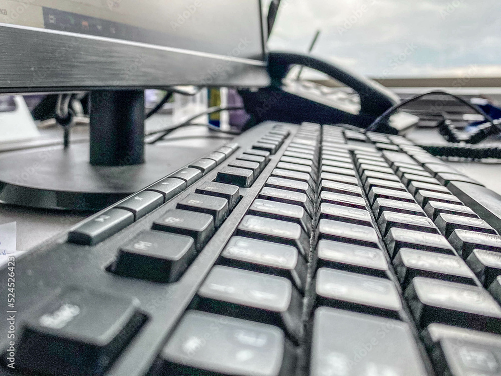Aufkleber black keyboard in the office. computer work. plastic keyboard with large letters and numbers. next t