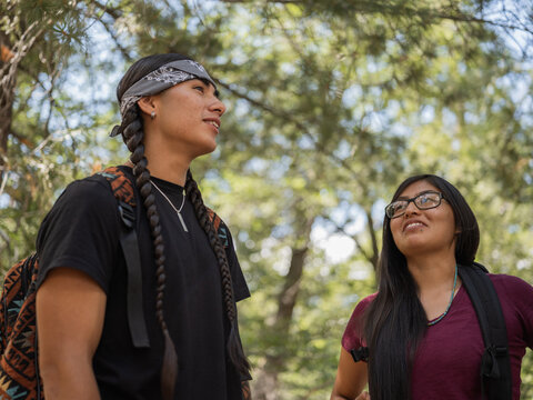 Indigenous young man and woman in nature