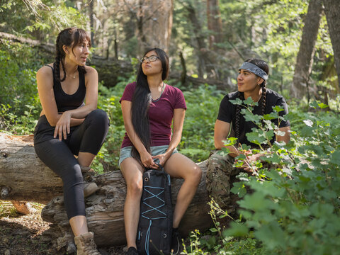 Indigenous young friends hiking in nature