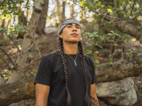Indigenous young man hiking in nature