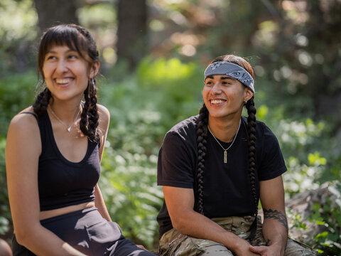 Indigenous young man and woman in nature