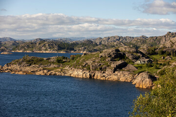 Fototapeta premium Happy people, enjoying amazing views in South Norway coastline, fjords, lakes, beautiful nature