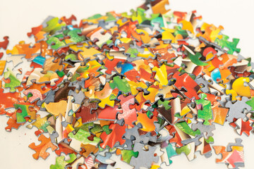 Fototapeta na wymiar Pile of puzzle pieces in a heap