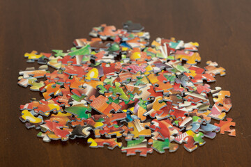 Colorful puzzle pieces in a pile on a table