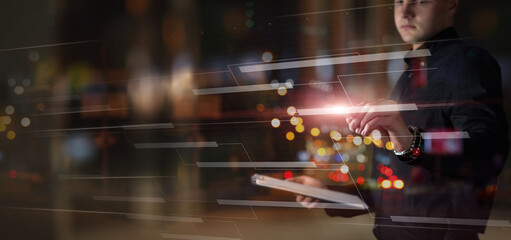 Businessman working with blueprint on virtual screen.