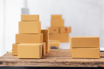 The cardboard box SME in the workplace at home. Start up a small business product for delivery to customers SME Online selling e-commerce packing concept.