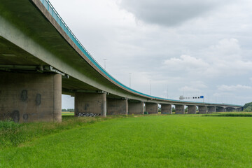Fototapeta na wymiar Motorway bridge over Nederrijn as part of the A50 road close to Doorwerth.