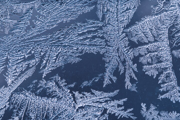 Cold Winter Frost Background frozen on Glass