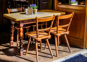 table and chairs at a sidewalk cafe