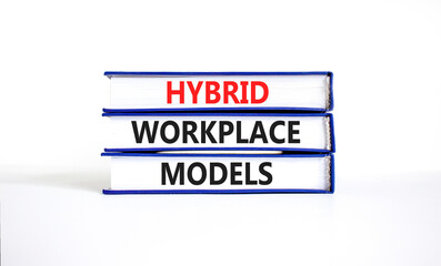 Hybrid workplace models and support symbol. Concept words Hybrid workplace models on books. Beautiful white table white background. Business and Hybrid workplace models quote concept. Copy space
