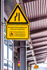 warning sign for a narrowed station platform in germany