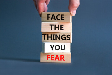 Face the things you fear symbol. Concept words Face the things you fear on wooden blocks on a...