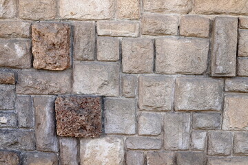 High wall made of stone and concrete.