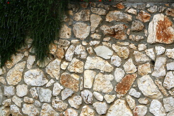 High wall made of stone and concrete.