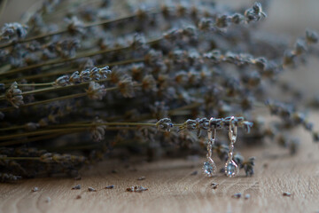 blue earrings with kyanite stones on a lavender background