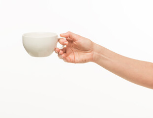 female hands hold a white cup on a white background isolated