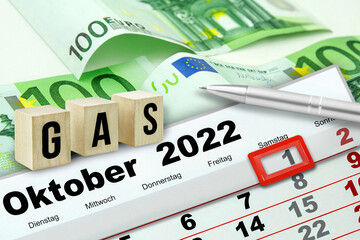 Deutscher Kalender Datum 1. Oktober  2022 mit Gas Symbolik und 300 Euro Geldscheinen - obrazy, fototapety, plakaty