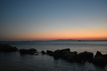 Tinos island,Sunset on the island Tinos ,Tinos is a Greek island situated in the Aegean Sea, located in the Cyclades archipelago, Greece.