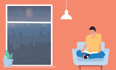 The guy is reading a book at home. Sofa and window, relaxation.