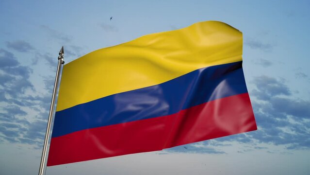 Colombian flag on a flagpole. 3D animation against a blue sky with clouds