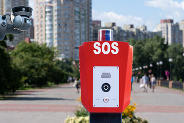 Security system in public parks. SOS, police, emergency button and security camera in a public park