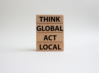 Think global act local symbol. Wooden blocks with words Think global act local . Beautiful white background. Business and Think global act local concept. Copy space.
