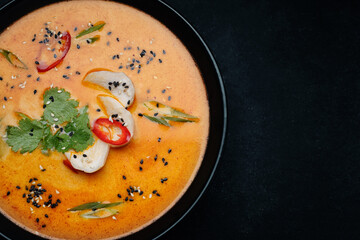 Thai soup in a plate with chicken