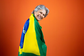  September 7th, Brazil's Independence Day - Mature Woman with Gray Hare Holding Brazil Flag