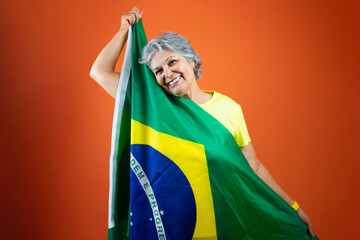  September 7th, Brazil's Independence Day - Mature Woman with Gray Hare Holding Brazil Flag