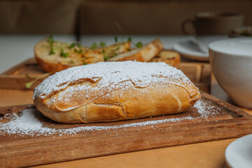 loaf of bread on wooden table