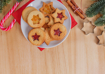 A plated with homemade traditional Christmas linzer cookies